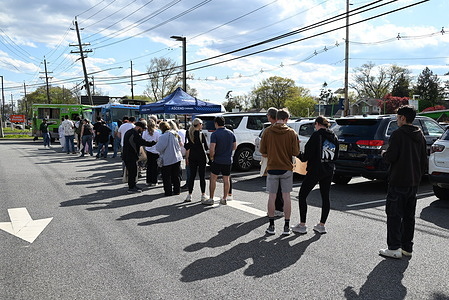 Recreational users of Cannabis line up at the Glazed and Confused donut food truck for a complimentary treat during the Ascend Wellness Dispensary event in Rochelle Park. Attendees browsed through the dispensary to purchase cannabis products and lined up to enjoy complimentary treats from food trucks at the event.