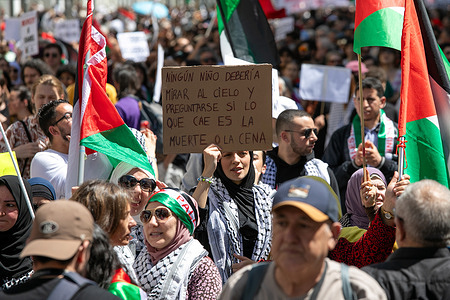 A protester holds a placard during a pro-Palestinian demonstration. The Solidarity Network against the Occupation of Palestine (RESCOP) together with other pro-Palestinian organizations demonstrated on the streets of Madrid to ask the Spanish Government of Pedro Sánchez to “End the arms trade and relations with Israel.” of “Enough of the complicity of the Government and companies” with the state of Israel.