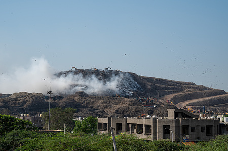 A view of the smoke from the landfill site, fire that has erupted at the Ghazipur landfill site, located on the outskirts of New Delhi. The Ghazipur landfill site is one of India's largest waste disposal sites, overflowing with trash and causing severe environmental and health hazards due to air and water pollution.