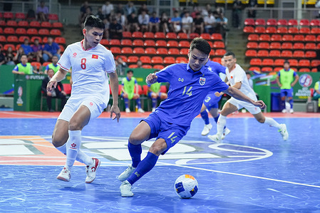 Apiwat Chaemcharoen(R) of Thailand and Dao Minh Quang of Vietnam seen in action during the AFC Futsal Asian Cup Thailand 2024 match between Thailand and Vietnam at indoor Stadium Huamark. Final score; Thailand 2:1 Vietnam.
