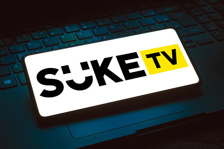 In this photo illustration, the Suke Limited logo is displayed on a smartphone screen.
