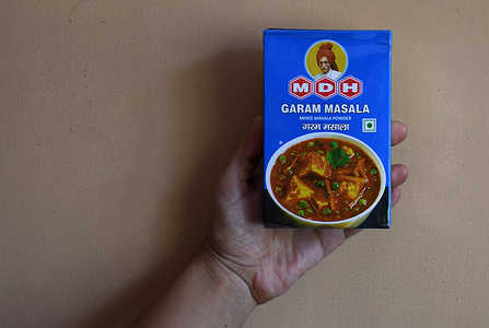 In this photo illustration, a hand is seen holding a box of MDH (Mahashian Di Hatti) spice powder. Hong Kong has banned the Indian brand MDH (Mahashian Di Hatti) spice powder after it found that it contained cancer-causing chemicals within it.