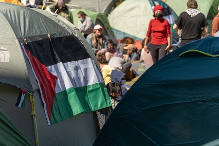 A Palestinian flag seen on the side of a tent on the South Lawn. Pro-Palestinian demonstrators rebuild their encampment with tents at Columbia University in solidary with Palestine. Classes at Columbia University were held remotely on Monday, amid ongoing demonstrations, due to the Jewish holiday of Passover.