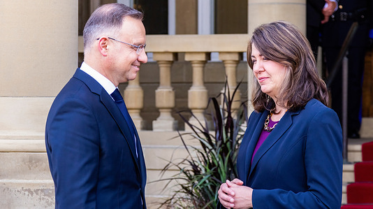 The Alberta Premier Danielle Smith (R) greets the President of Poland Andrzej Duda (L) at the front door of Government House during his visit.