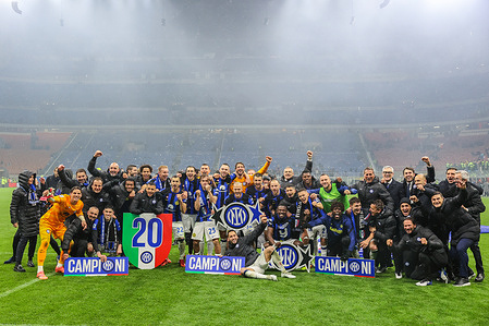 FC Internazionale players and staff celebrate their victory at the end of the Serie A 2023/24 football match between AC Milan and FC Internazionale at San Siro Stadium. Inter Milan secured their 20th Italian championship title, known as the Scudetto, on Monday night with a 2-1 victory over AC Milan. Francesco Acerbi and Marcus Thuram scored the decisive goals in a match marked by three-player dismissals. Inter emerged victorious in what was technically an AC Milan home game. Acerbi's unmarked header in the 18th minute solidified Inter's dominant performance, positioning them closer to their anticipated Scudetto triumph.