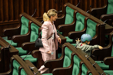 A toddler visits a parliamentary room during the 10th session of Polish Parliament in the Parliament building on Wiejska Street. The parliament discusses controversial issues of the rule of law.