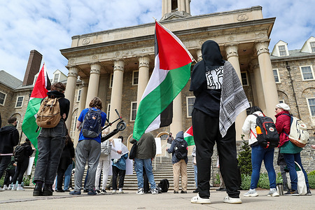 Pro-Palestine protesters rally in front of Old Main on the campus of Penn State University. Penn State Students for Justice in Palestine, in collaboration with other organizations, organized a day-long Popular University for Gaza, featuring teach-ins, sidewalk chalking, and a rally at Old Main.
