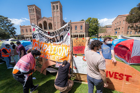 Pro-Palestinian protesters gathered at an encampment at the University of California, Los Angeles (UCLA), on Friday, April 26, 2024, in Los Angeles. The protesters were protesting on campuses across the country, demanding colleges cut investments supporting Israel.