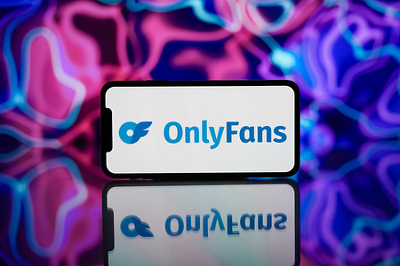 In this photo illustration, the OnlyFans logo is seen displayed on a mobile phone screen.