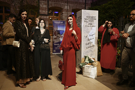 Guests are seen at the entrance of the Fisekhane Gallery on the second day of the Istanbul Modest Fashion Week 2024.