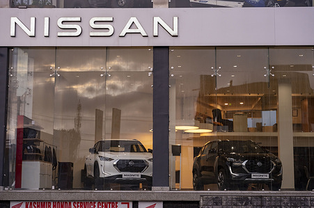 Nissan SUV Cars are seen on display inside a Nissan showroom.