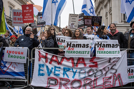 Protesters hold placards, wave flags and chanting slogans during the demonstration in London, UK. Pro-Israel counter protest has been staged in Central London, during the Pro-Palestine national march. Protesters demand the release of hostages and to stop supporting the Hamas in Gaza.