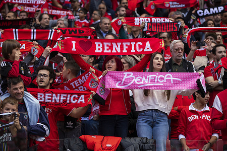 SL Benfica supporters hold scarves during the Liga Portugal Betclic football match between SL Benfica and SC Braga at Estadio da Luz Stadium. (Final score: SL Benfica 3 - 1 SC Braga)