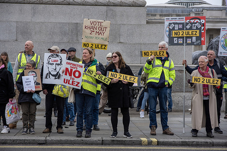 Protesters hold placards during the demonstration on the Trafalgar Square in London, UK. ULEZ stands for Ultra Low Emission Zone. It has been introduced in April 2019 to help generate a cleaner air in London. The expansion happened on the end of August 2023. Now, the ULEZ covers the majority of land within M25. Protesters blame for that Sadiq Khan, the Mayor of London and they do not believe in air pollution.