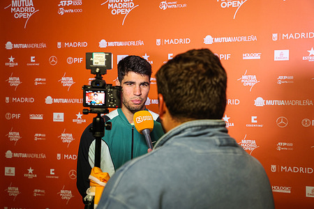 Carlos Alcaraz of Spain is being interviewed after defeating Thiago Seyboth Wild of Brazil (not pictured) on Day Seven of the Mutua Madrid Open 2024 tournament at La Caja Magica.