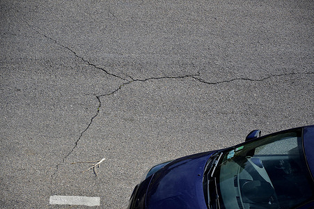 Cracks on a road in Marseille. A combination of poor road maintenance and climatic factors are responsible for a deterioration of the French road network.