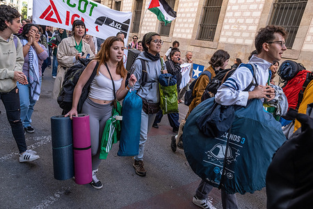 Protesters are seen with their bags and camping tents heading to occupy the Central University of Barcelona to spend the night at the cloister. More than a hundred students organized a protest camp at the cloister of the Central University of Barcelona to show their solidarity with the Palestinian people.