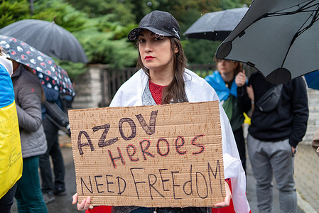 A participant holds a placard with the inscription, "Azov heroes need freedom'' during the rally. Dozens of people gathered in front of the Russian embassy in Warsaw and ordered the Russians to release the Ukrainian defenders of Azovstal and Mariupol. Mothers, wives and families of Mariupol soldiers, including Azov, protested in front of the embassy.