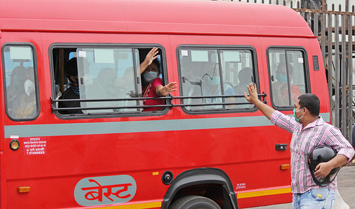 Man waves Covid 19 patients on a bus being transferred from a makeshift hospital ahead of the cyclone.
India Meteorological Department (IMD) says that tropical cyclone ‘Nisarga’ is headed for the Maharashtra coast. People have been advised to stay indoors, be prepared to face possible power cuts as strong winds hit the city. National Disaster Response Force (NDRF) has positioned nine teams in vulnerable districts.