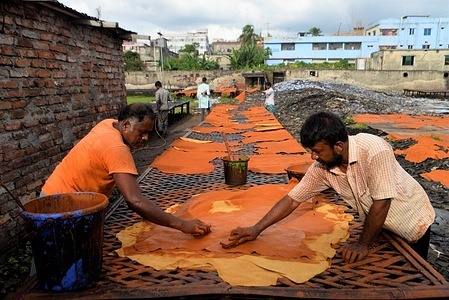 Men are seen working at a tannery in Hazaribagh, Dhaka.
Most people in this area have become victims of pollution due to the presence of toxic chemicals, mainly chromium. The air of Hazaribagh is polluted with the smoke from the waste from the tannery industry.