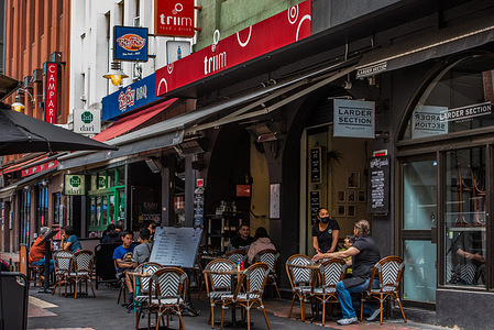 People dine at a restaurant on Hardware Lane, Melbourne CBD.