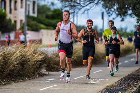 A group of runners with Shaine Webber in front seen sprinting during the 2XU Triathlon Series 2021, Race 2 at Sandringham.