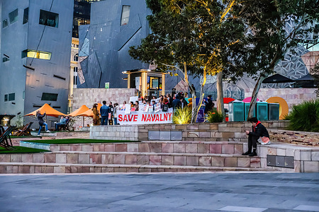 Protesters hold a banner and placards at Melbourne's Federation Square during the demonstration.Protesters held a rally in support of Alexey Navalny at the Federation Square in Melbourne and Anti Putin placards were seen at the rally.