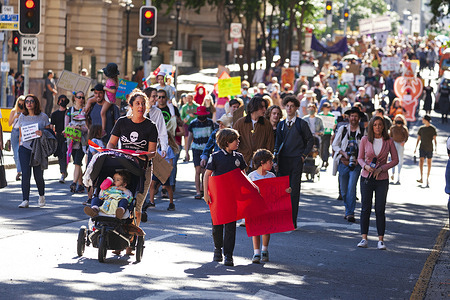 Kids march through the Street while holding placards during the demonstration.
Thousands of students and their supporters have walked out of classrooms and workplaces to join School Strike 4 Climate events around the country, becoming part of a global youth-led movement pleading for urgent action on climate change.