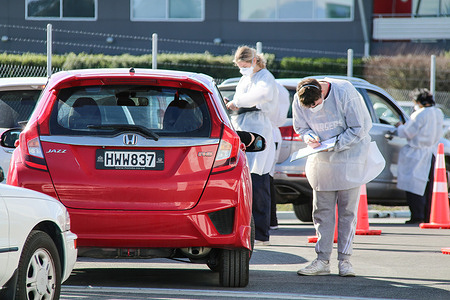 Health workers at a drive-thru covid-19 testing station on Orchard Road in Christchurch.New Zealand has so far confirmed 2,954 Coronavirus cases with 2,873 Recovered and 26 Deaths.