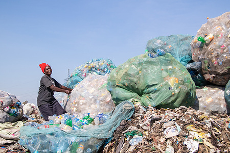 A woman is seen sorting plastic bottles waste at Gioto Dumping Site to be taken to a recycling facility nearby.
The growing problem of plastic waste ending up in the environment is becoming a concern and environmentalists are calling for more investments in the infrastructure to recycle plastic to promote circular economy and reduce plastic pollution. They are also asking the government to introduce a mandatory bottle deposit and refund scheme (DRS) which will give value to plastic drink bottles commonly known as pet (polyethylene terephthalate). Deposit refund scheme is a system where consumers pay a small amount of money upfront called a deposit, to be reimbursed to them when they return the container to a shop or collection center.