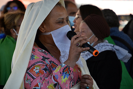A woman sings an Algerian song during the anniversary.
People gathered for the 60th anniversary of October 17, 1961. On that day, dozens of Algerians were killed during a demonstration in Paris fiercely suppressed by the police.