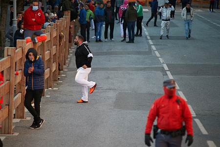 A participant prepares to run during the second running of the bulls of Hermanas Azcona cattle ranch
Second running of the bulls of Hermanas Azcona cattle ranch was held in Navarra, Spain after a year and a half without cultural celebrations due to the Covid-19 pandemic.