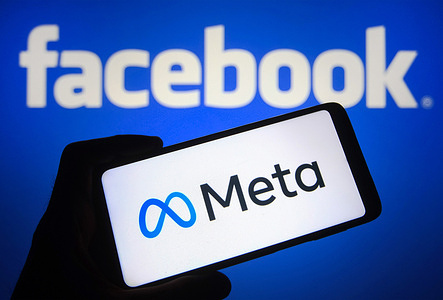 In this photo illustration a Meta logo is seen on a smartphone screen with a Facebook logo in the background. Facebook changes name to Meta in its major rebrand, reportedly by media.