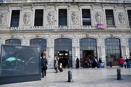Travelers are seen at the entrance to Saint-Charles train station.