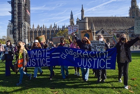 Protesters holding placards and a banner expressing their opinion during the demonstration.
Protesters marched from Downing Street to Parliament Square as part of the global youth-led Fridays For Future movement, demanding action on the climate emergency.