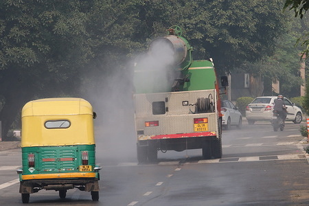 An anti-smog gun mounted on a vehicle sprays water into the atmosphere to reduce dust pollution as pollution levels risen in New Delhi.
Delhi struggles with the issue of poor air quality after Diwali celebration with fireworks emissions and stubble burning on agricultural land by farmers in nearby states during harvesting season.
