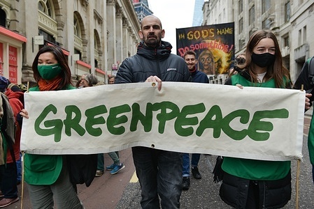 Protesters hold a banner saying Greenpeace during the demonstration.
Climate activists gathered outside the Bank of England and marched to Trafalgar Square for a rally on a Global Day of Action for Climate Justice. Protesters demand governments and corporations to control global temperatures rise and deliver real solutions to the climate crisis.