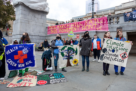 Protesters seen holding a banner saying 'Climate solutions not climate pollution' during the demonstration.
Thousands of people marched from the Bank of England to Trafalgar Square as part of the Global Day of Action For Climate Justice, as world leaders continued to meet in Glasgow for the COP26 climate change conference.