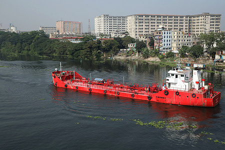 An oil tanker sails over the pitch black water of the Shitalakshya river near Dhaka city.
Shitalakshya river, which flows by Dhaka city, is now one of the most polluted rivers in the world because of rampant dumping of human and industrial waste.