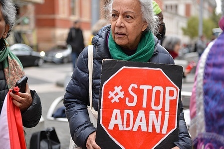 A protester holds a "Stop Adani" placard during the demonstration.
Extinction Rebellion activists staged a protest opposite the Science Museum in South Kensington against sponsorship of the museum by fossil fuels corporations Shell and Adani.