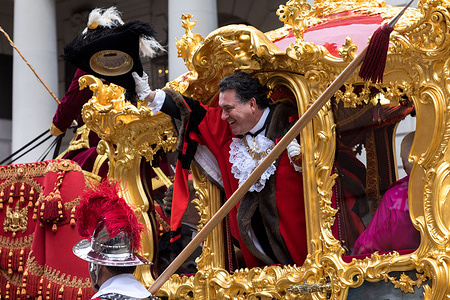 Mayor of city of London Alderman Vincent Keavenyseen waving his hat from the golden carriage, during the parade.
The Lord Mayor's Show dates back to the early 13th century, when King John rashly allowed the City of London to appoint its own Mayor. Every year, the newly-elected Mayor tours the city in a golden carriage to swear loyalty to the Crown. This year, Alderman Vincent Keaveny was elected as the 693rd Lord Mayor of the City of London. The parade begins at Mansion House.