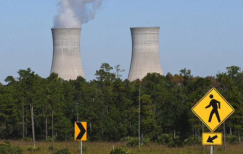 The cooling towers at the Stanton Energy Center, a coal-fired power plant, are seen in Orlando. The facility is projected to convert from burning coal to using natural gas by 2027. U.N. climate talks ended on November 13, 2021 with a deal that for the first time targeted fossil fuels as the key driver of global warming, even as coal-reliant countries lobbed last-minute objections.