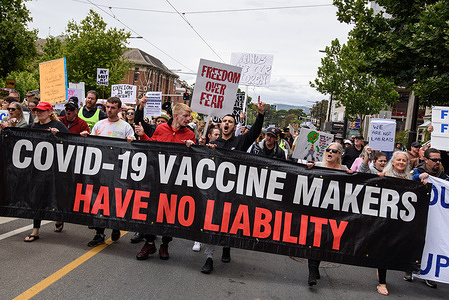 Protesters march through the streets while holding a banner and placards during the demonstration.
Protesters took to the streets to protest against COVID-19 lockdowns and vaccine mandates. Protests were organized in all major cities across Australia as part of a global day of action against mandatory vaccines, lockdowns and restrictions imposed during the pandemic.