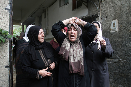 Relatives of Israa Al-Khazmieh mourn during the funeral ceremony.
Al-Khazmieh was killed by the Israeli gunfire after she attempted to stab an officer in the Old City of Jerusalem.