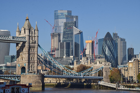 General view of Tower Bridge and City of London, the capital's financial district, on a clear, sunny day.