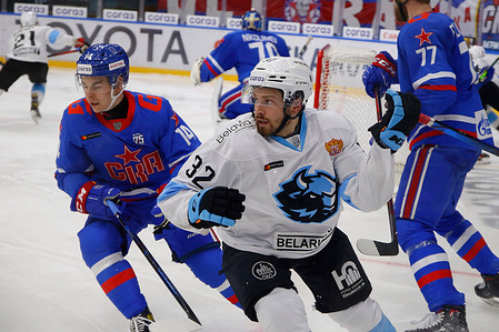 Lukas Bengtsson (C) of Dinamo Minsk and Nikita Sedov (L) of SKA Saint Petersburg are seen in action during the 2021-22 KHL Regular season of the Kontinental Hockey League between SKA Saint Petersburg and Dinamo Minsk at the Ice Sports Palace.
Final score; SKA Saint Petersburg 2:1 Dinamo Minsk.