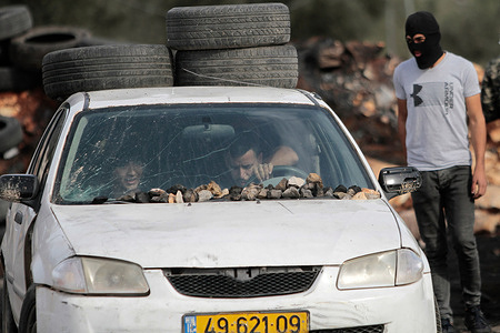 A car seen carrying stones and tires during clashes with the Israeli army.Palestinians have been protesting every Friday and Saturday in the village of Kafr Qaddum since 2011 against the closure of one of their roads and the confiscation of their land by the Israeli authorities. These decisions were made to expand the Israeli settlement of Kedumim.
