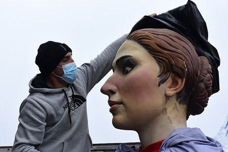 A participant prepares a Gigante (Giant) for the Giants and Big Heads celebration.
This Sunday, the village of Golmayo, north of Spain celebrates the National of Gigantes and Cabezudos (Giants and Big Heads) Festival. Gigantes and Cabezudos were created to represent archetypes and the tradition of the Spanish region. They are dressed in typical regional wedding and fiesta costumes.