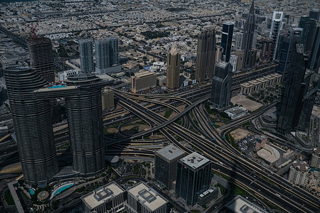 A view from Burj Khalifa towards residential and commercial skyscrapers at Dubai downtown district.