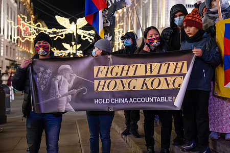 Participants are seen holding a banner that says "Fight with Hong Kong" during the protest.
Various anti-Chinese Communist Party (anti-CCP) communities in London gathered at the Piccadilly Circus and marched to 10 Downing Street. Hong Kongers, Tibetans, and Uighurs unite to condemn the attempts of the CCP to oppress the dissenting voices. Protesters demanded the Western world to boycott the 2022 Beijing Winter Olympic games in response to the suppression of human rights in China.